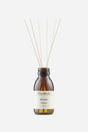 Brun flaske med Munkholm Woody diffuser, 100 ml, med duftpinde i toppen.