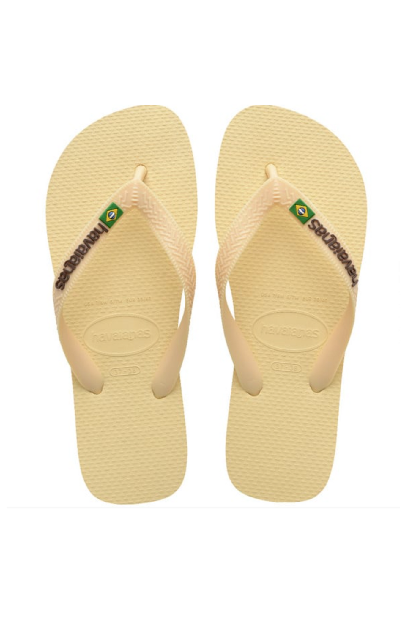 Havaianas klipklappere i buttercream med logo og brasiliansk flag på stropperne.