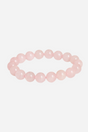 Armbånd af runde rosa kvartsperler, ensartet i størrelse, med lys pink og blank overflade.