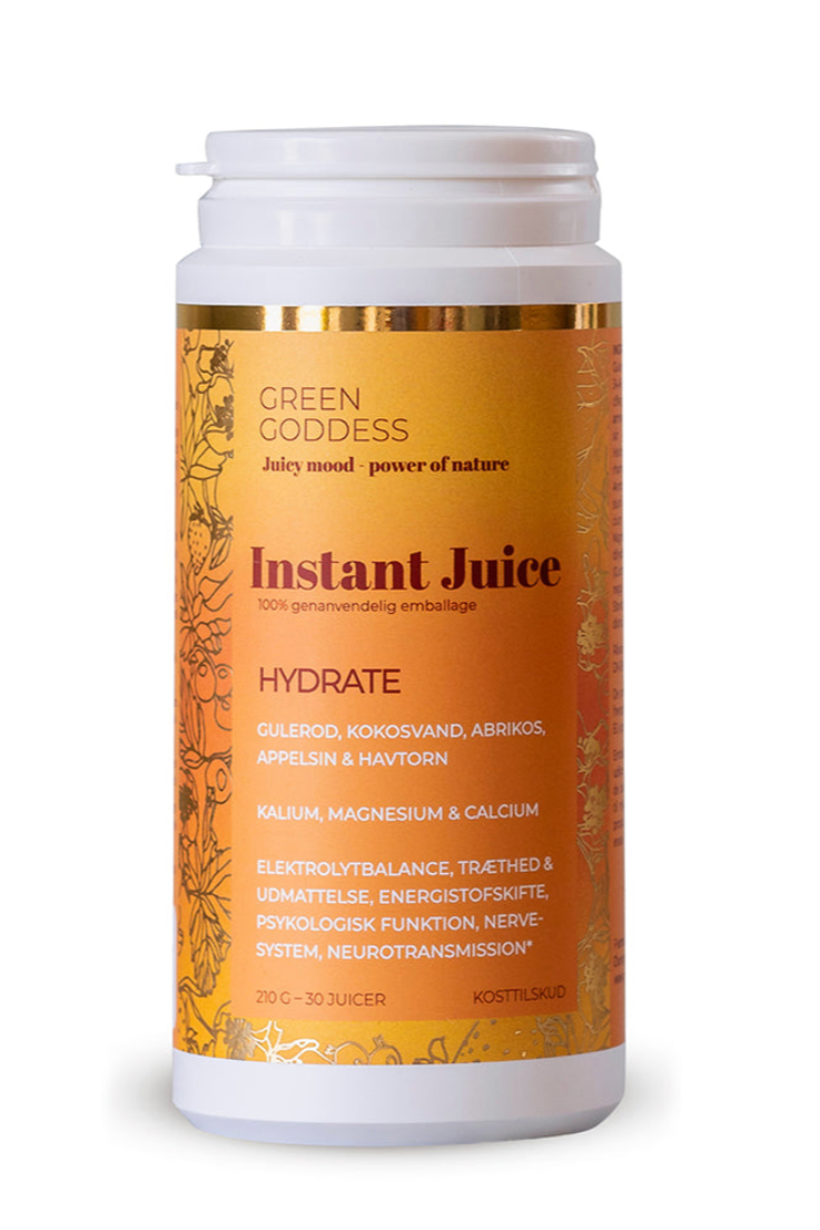 Orange beholder med "Green Goddess - Instant Juice - HYDRATE" påskrift, ingredienser og mineraler.