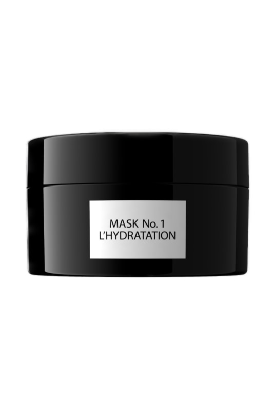 Sort cylindrisk beholder med etiket: "MASK No. 1 L'HYDRATATION." Enkel og elegant design.